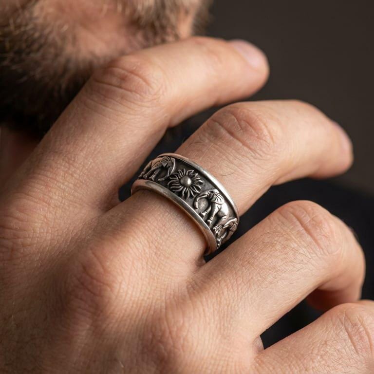 Oxidized elephant spinner fidget ring worn on finger as a statement band, 925 sterling silver with engraved animal relief and inner engraving option