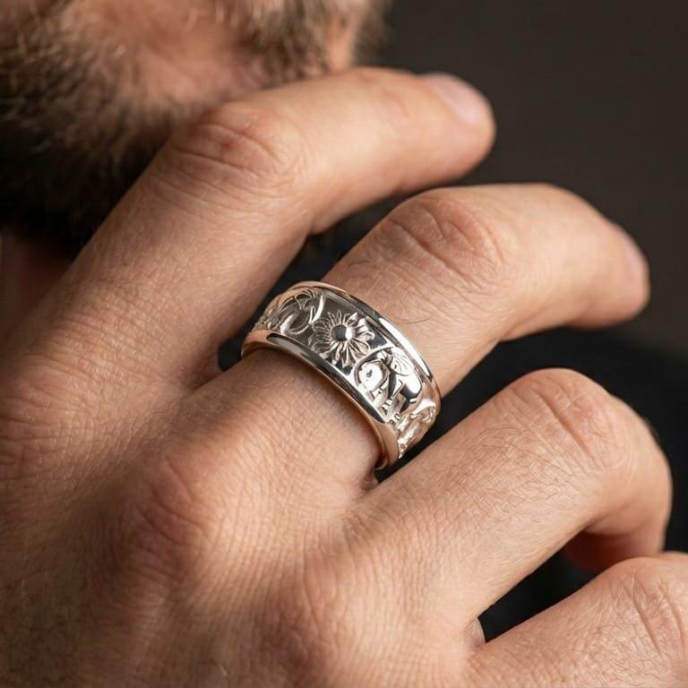 Polished silver spinning elephant band ring worn on hand highlighting clean shine, comfort fit profile, and tactile fidget movement for daily wear