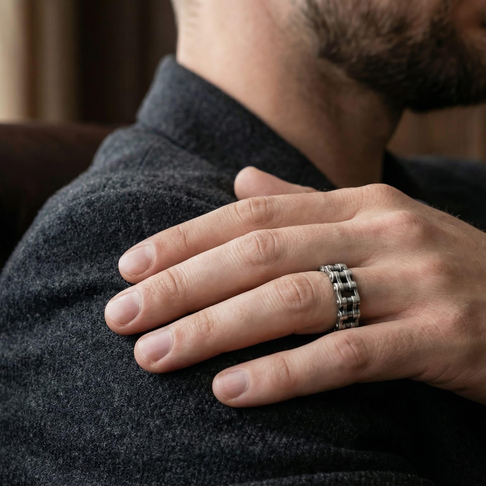 Oxidized steampunk chain band ring worn on finger as a bold industrial statement ring with biker-inspired edge