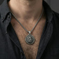 Load image into Gallery viewer, Oxidized Zeus pendant necklace worn on neck, lifestyle close-up on dark outfit, Greek myth medallion centered
