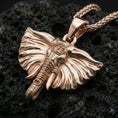 Load image into Gallery viewer, Rose gold plated elephant jewelry pendant on volcanic rock, premium macro product photo, ornate head detail and bail
