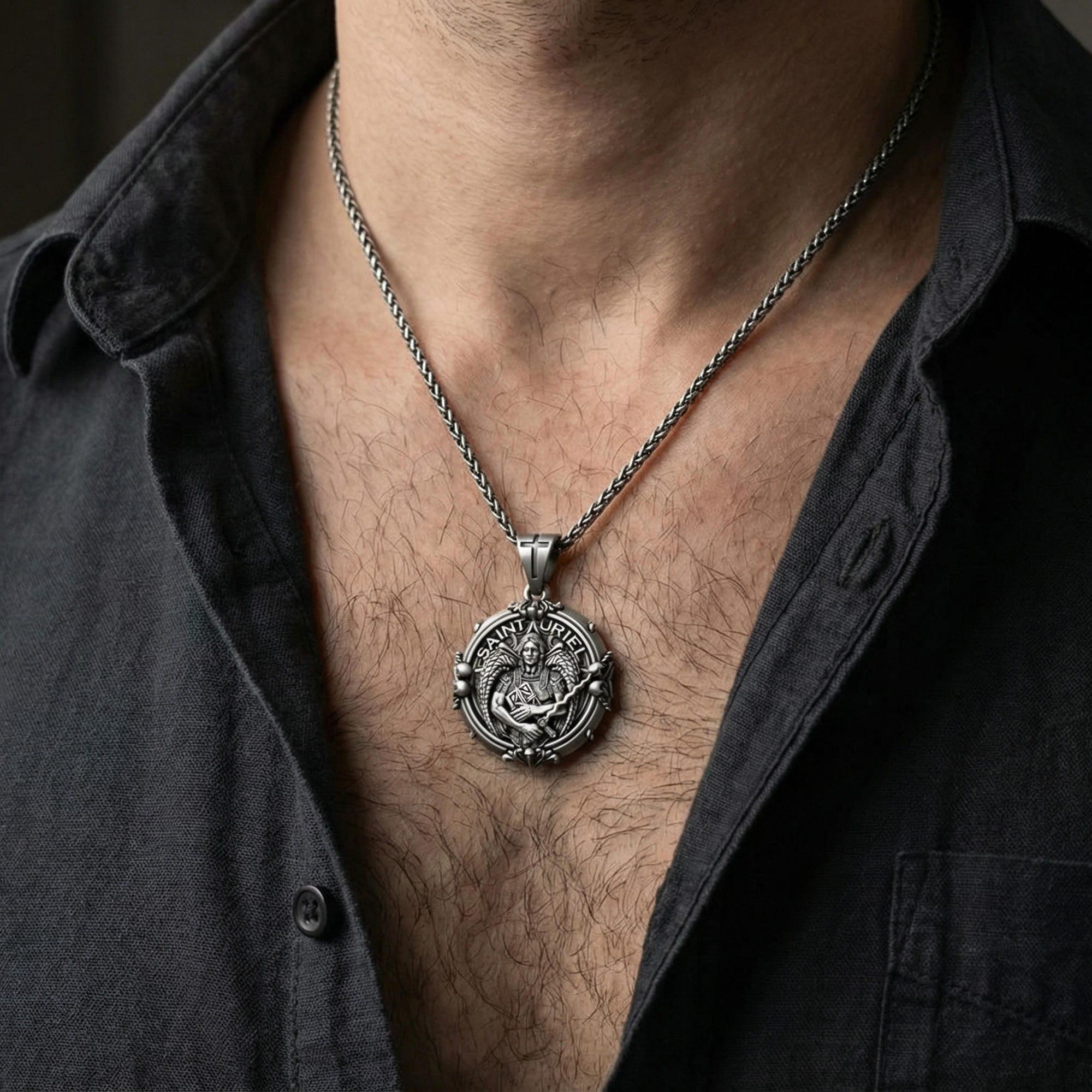 Oxidized Saint Uriel pendant necklace worn on neck, lifestyle close-up on dark outfit, angel medallion centered