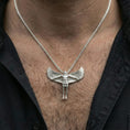 Load image into Gallery viewer, Polished silver Archangel Michael pendant on chain worn on neck, natural lifestyle framing, wings and body details clearly visible
