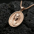 Load image into Gallery viewer, Rose gold plated Veiled Madonna religious pendant on volcanic rock, premium macro product photo, sharp oval silhouette and veil detailing
