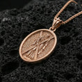 Load image into Gallery viewer, Rose gold plated Saint Andrew oval medallion pendant on volcanic rock surface, macro product shot, clean silhouette and sharp engraving
