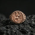 Load image into Gallery viewer, Rose gold plated mermaid ring on volcanic rock surface, mermaid motif with coastal waves and fine scrollwork, high-end studio lighting
