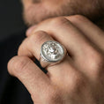 Load image into Gallery viewer, Polished silver Medusa ring on finger, statement signet style with detailed gorgon face and clean shine
