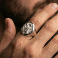 Load image into Gallery viewer, Polished silver signet ring on hand, high-relief Japanese guardian design, natural lifestyle photo
