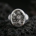 Load image into Gallery viewer, Polished Silver: Polished sterling silver signet ring with intricate Japanese guardian relief on volcanic rock, close-up detail
