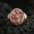 Load image into Gallery viewer, Rose Gold Plated: Rose gold plated signet ring featuring ornate yokai-style relief on volcanic rock, luxury close-up shot

