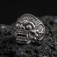 Load image into Gallery viewer, Balinese Barong god sterling silver ring in an oxidized finish on volcanic rock, macro studio product photo
