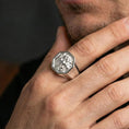 Load image into Gallery viewer, Octagon Foo Dog signet ring in polished silver finish on finger, sharp guardian lion details, natural lifestyle wear shot
