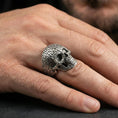 Load image into Gallery viewer, 925 sterling silver numerology skull ring in an oxidized finish worn on finger, number-textured skull detail visible, lifestyle hand close-up
