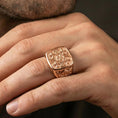 Load image into Gallery viewer, Jerusalem Cross ring in a rose gold plated finish on finger, detailed medieval cross engraving, lifestyle wear photo
