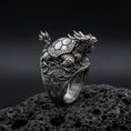 Load image into Gallery viewer, Sterling silver dragon turtle ring in an oxidized finish on volcanic rock, detailed Eastern mythical creature sculpture, macro studio product shot
