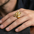 Load image into Gallery viewer, Undead oni mask ring in a gold plated finish worn on finger, bold Japanese demon skull statement design, masculine lifestyle close-up
