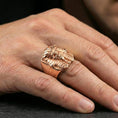 Load image into Gallery viewer, Pharaoh skull ring in a rose gold plated finish on finger, detailed pharaoh headdress skull design, lifestyle wear photo
