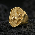 Load image into Gallery viewer, Gryphon signet ring in a gold plated finish on volcanic rock, bold mythical griffin emblem design, premium macro product image
