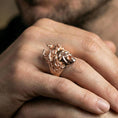 Load image into Gallery viewer, Medusa ring in a rose gold plated finish on finger, detailed gorgon head with snakes, lifestyle wear photo
