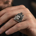 Load image into Gallery viewer, Sterling silver Medusa ring in an oxidized finish worn on finger, gorgon portrait and snake hair details visible, lifestyle hand close-up
