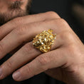 Load image into Gallery viewer, Medusa gorgon ring in a gold plated finish worn on finger, bold snake hair statement jewelry style, masculine lifestyle close-up
