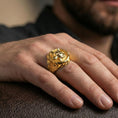 Load image into Gallery viewer, Fenrir wolf of the moon ring in a gold plated finish worn on finger, bold Viking wolf statement ring style, masculine lifestyle close-up

