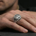 Load image into Gallery viewer, Yggdrasil tree of life signet ring in polished silver finish on finger, Celtic-inspired branches and roots relief, everyday lifestyle wear shot
