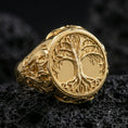 Load image into Gallery viewer, Tree of life Yggdrasil signet ring in a gold plated finish on volcanic rock, Celtic Norse symbolism design with raised branch detailing, high-end macro image
