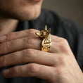 Load image into Gallery viewer, Anubis ring in a gold plated finish worn on finger, bold Egyptian god statement design with Eye of Horus accent, premium lifestyle photo
