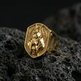 Load image into Gallery viewer, Egyptian Anubis ring in a gold plated finish on volcanic rock, protective jackal deity design with skull detail, luxury macro jewelry photo
