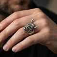 Load image into Gallery viewer, Sterling silver Hannya mask ring in an oxidized finish worn on finger, Japanese demon horns and face centered, dark aesthetic lifestyle close-up
