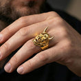 Load image into Gallery viewer, Japanese demon Hannya ring in a gold plated finish worn on finger, bold horned mask relief, premium lifestyle close-up
