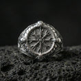 Load image into Gallery viewer, Vegvisir rune compass ring in polished silver finish on volcanic rock, detailed Norse stave engraving with clean shine, close-up product photo
