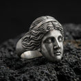 Load image into Gallery viewer, Detailed Venus de Milo ring crafted in oxidized sterling silver, classical Greek goddess face sculpture, macro product shot on textured volcanic rock background
