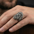 Load image into Gallery viewer, Oxidized sterling silver Zeus ring worn on finger, bold Greek god design with detailed beard and curls, masculine lifestyle hand shot

