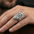 Load image into Gallery viewer, Polished silver Zeus ring on finger highlighting sculpted facial features and classical mythology style, clean lifestyle wear photo
