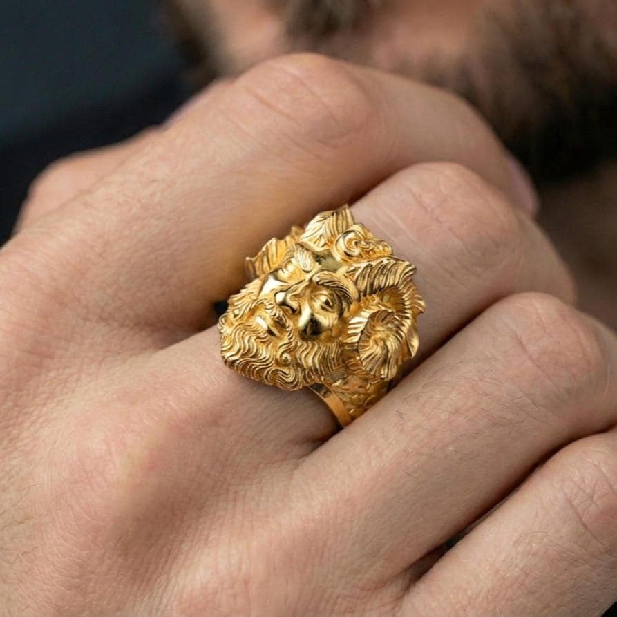Gold plated Czernobog signet ring worn on finger, statement dark mythology jewelry inspired by Slavic legends, premium lifestyle close-up