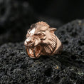 Load image into Gallery viewer, Rose gold plated werewolf ring showcasing gothic wolf head design with sculpted teeth and fur lines, sharp close-up product photography on volcanic rock
