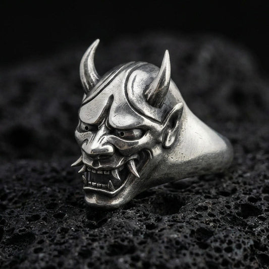Oxidized sterling silver Oni mask signet ring on black volcanic stone, Japanese demon face with horns and fangs, gothic biker style