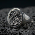Load image into Gallery viewer, Oxidized sterling silver Chinese dragon signet ring on black volcanic stone, coiled imperial dragon relief, lunar new year jewelry
