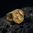 Load image into Gallery viewer, Gold plated dragon signet ring on black volcanic stone, mythological winged dragon design, powerful statement jewelry
