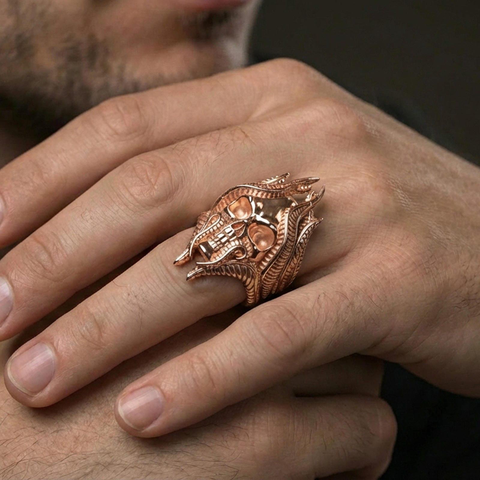 Rose gold plated lich skull ring on a human finger, gothic skull signet, dark fantasy aesthetic