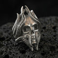 Load image into Gallery viewer, Oxidized sterling silver lich skull ring on black volcanic stone, biomechanical skull details, gothic wizard fantasy jewelry
