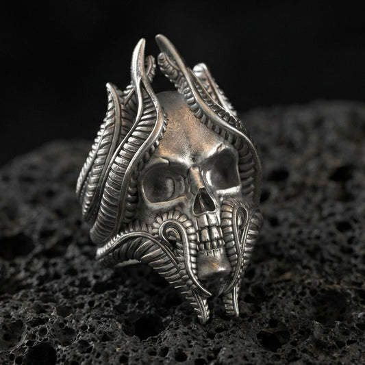 Oxidized sterling silver lich skull ring on black volcanic stone, biomechanical skull details, gothic wizard fantasy jewelry