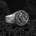 Load image into Gallery viewer, Oxidized sterling silver wolf and dragon ring on black volcanic stone, intertwined fantasy creatures, detailed engraved band
