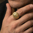 Load image into Gallery viewer, Gold plated dragon eye ring worn on a human finger, fantasy creature eye motif, statement ring

