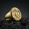 Load image into Gallery viewer, Gold plated dragon signet ring on black volcanic stone, raised winged dragon motif, medieval fantasy ring
