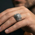 Load image into Gallery viewer, Polished sterling silver alien skull ring on a human finger, biomechanical sci-fi relief, bold gothic jewelry
