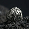 Load image into Gallery viewer, Oxidized biomechanical alien skull ring on black volcanic stone, sci-fi gothic signet, detailed xenomorph-style relief
