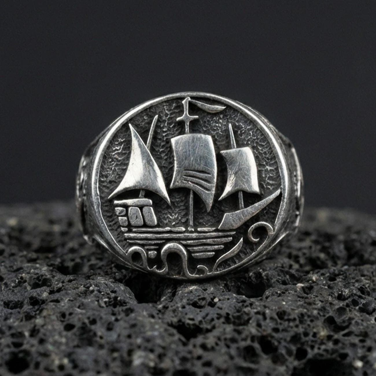 Oxidized sterling silver Flying Dutchman ship signet ring on black volcanic stone, nautical sailing ship relief, pirate explorer ring